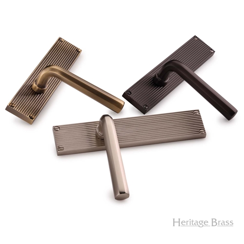 Octave Reeded Door Handle on Plate in Antique Brass