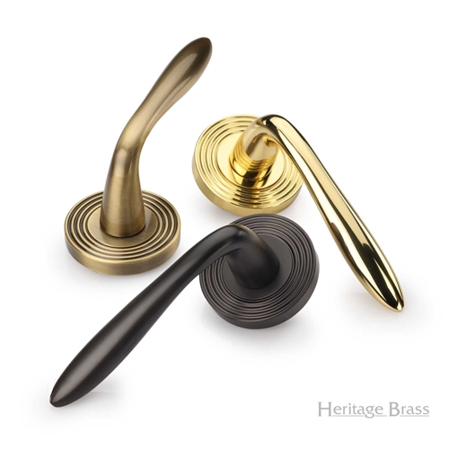 Sutton Reeded Door Handle on Round Rose in Satin Brass
