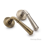 Bridgetown Reeded Door Handle on Round Rose in Antique Brass