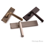 Octave Reeded Door Handle on Plate in Antique Brass