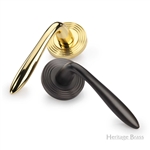 Sutton Reeded Door Handle on Round Rose in Satin Brass