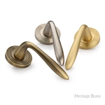 Sutton Reeded Door Handle on Round Rose in Satin Brass