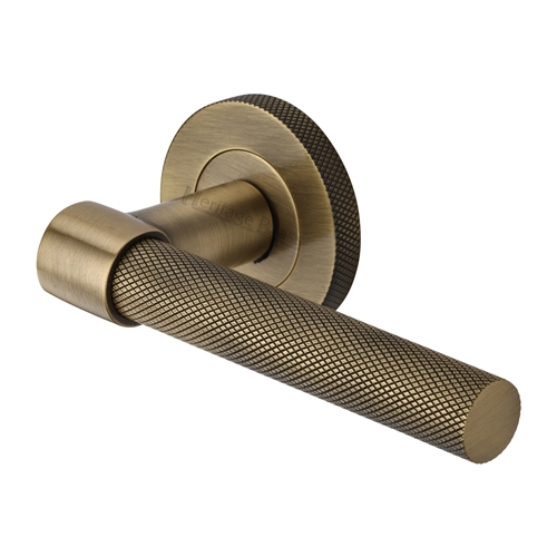 Heritage Brass Door Handle Lever on Knurled Rose Phoenix Knurled Design in Antique Brass