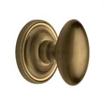 Chelsea Door Knob on Rose in Antique Brass