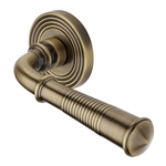 Bridgetown Reeded Door Handle on Round Rose in Antique Brass