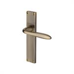 Sutton Reeded Door Handle on Plate in Antique Brass