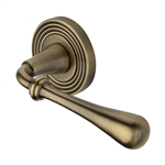 Roma Reeded Door Handle on Round Rose in Antique Brass