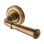 Colonial Door Handle on Round Rose in Antique Brass