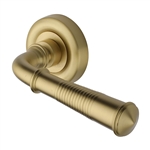 Colonial Reeded Door Handle on Round Rose in Satin Brass