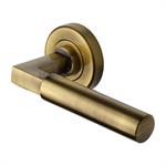 Bauhaus Door Handle on Round Rose in Antique Brass