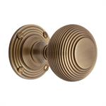 Reeded Mortice Door Knob on Rose in Antique Brass
