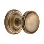 Whitehall Door Knob on Rose in Antique Brass